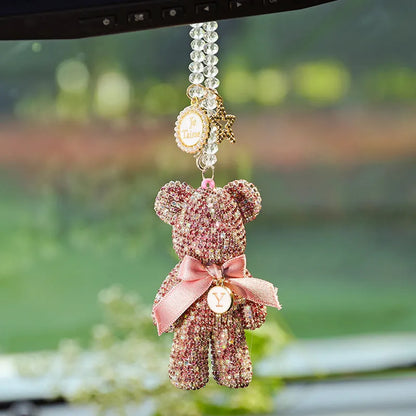 White artificial crystal rhinestone violent bear car rearview mirror pendant measuring 5x9cm.