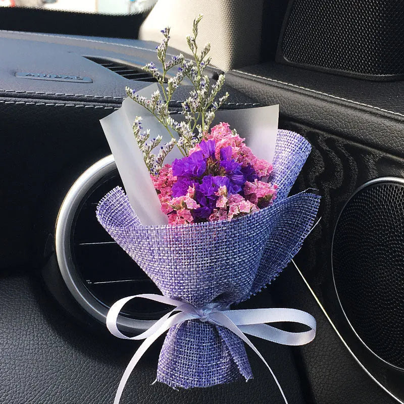 Mini dried flower bouquet mounted in car air vent for decorative aromatherapy