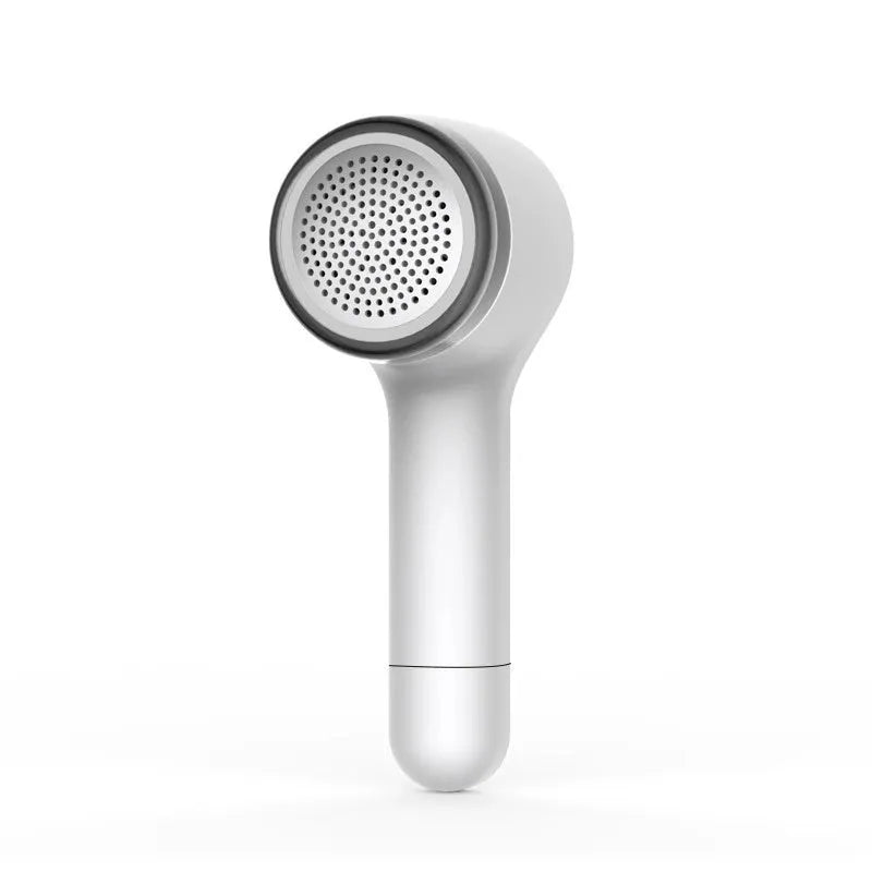 USB rechargeable hair ball trimmer in black, green, red, or white on a fabric background.