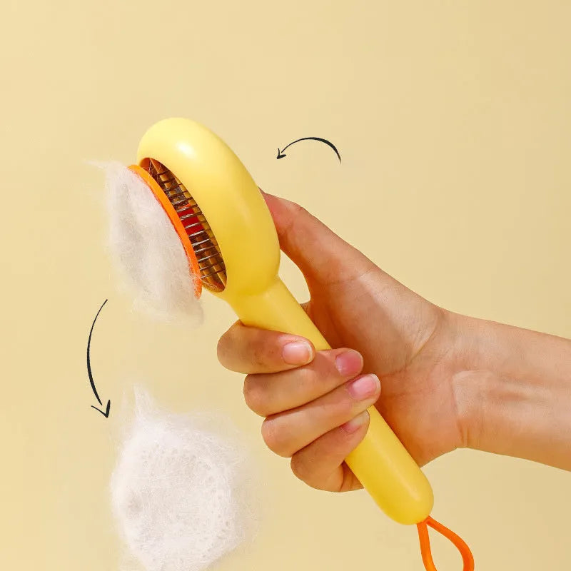Small yellow duck-shaped pet grooming comb with needle pins and open section design