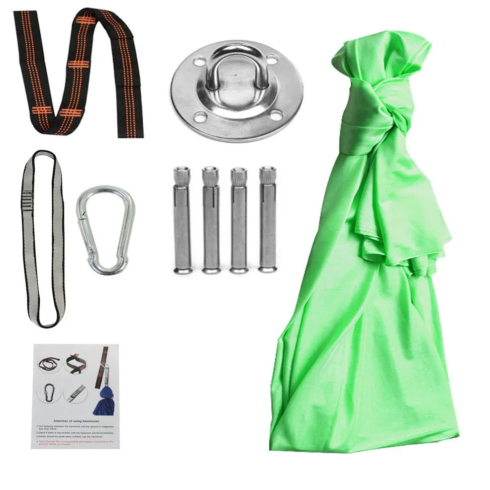 Child in black therapy swing cocoon with multi-loop daisy chain height adjustment system