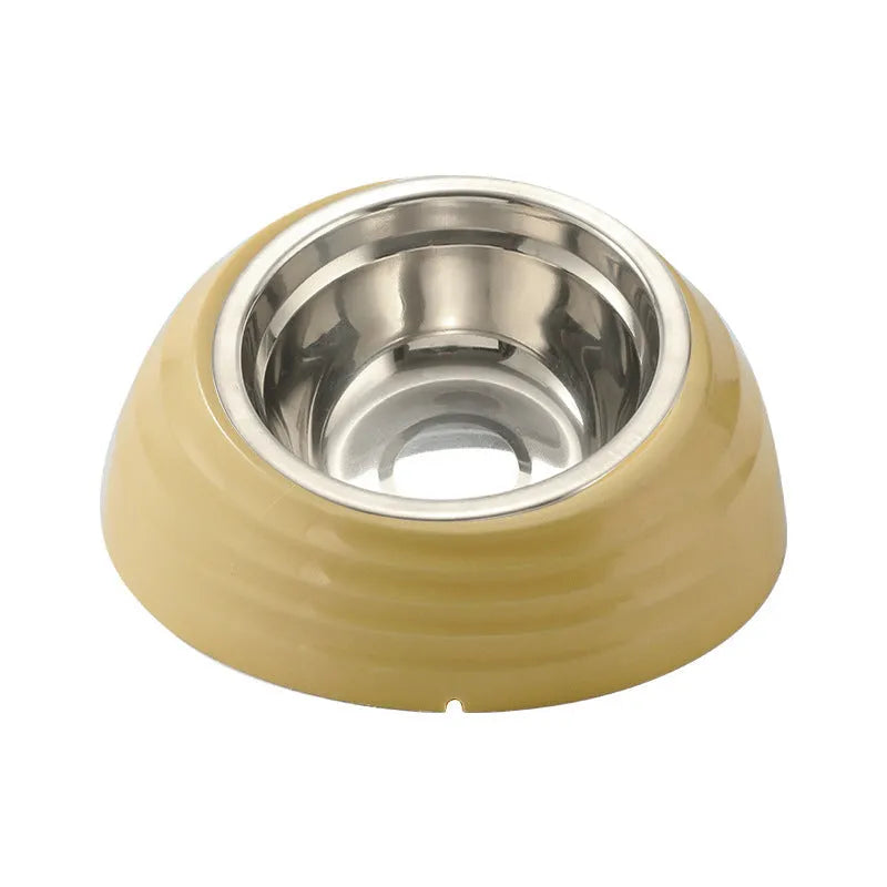 Single stainless steel cat bowl with a light green plastic base on a floor.