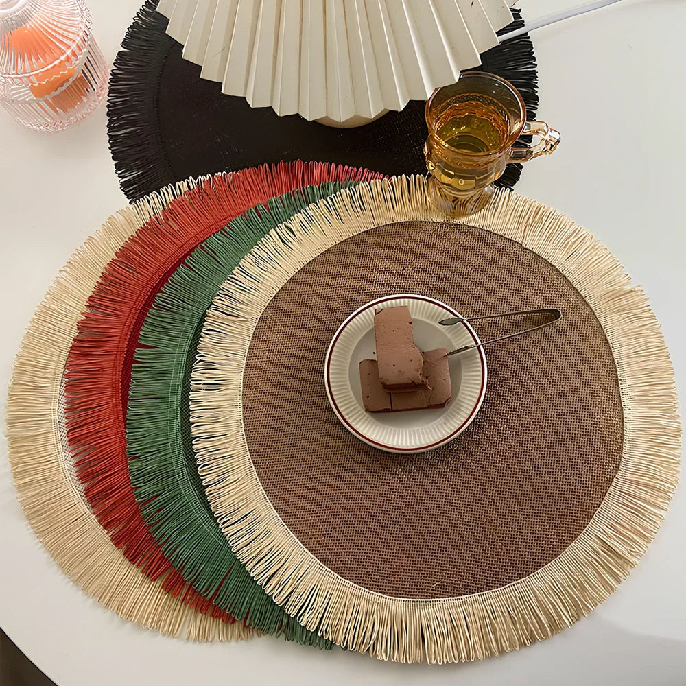 Round handwoven jute placemat with decorative tassels measuring 30cm diameter in Christmas green colour