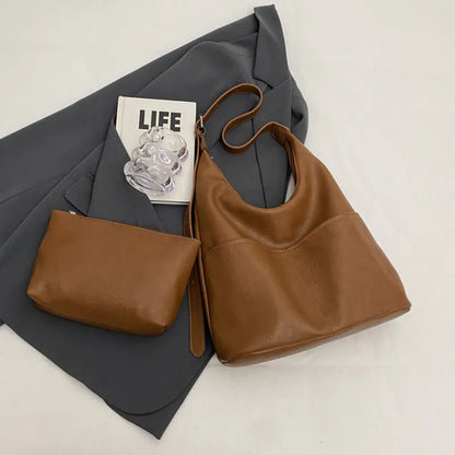 Women's soft PVC bucket shoulder bag with single strap, open pocket, phone pocket, and matching wallet