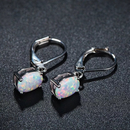 Four-claw oval opal earrings in gold, rose gold, or silver with electroplated finish