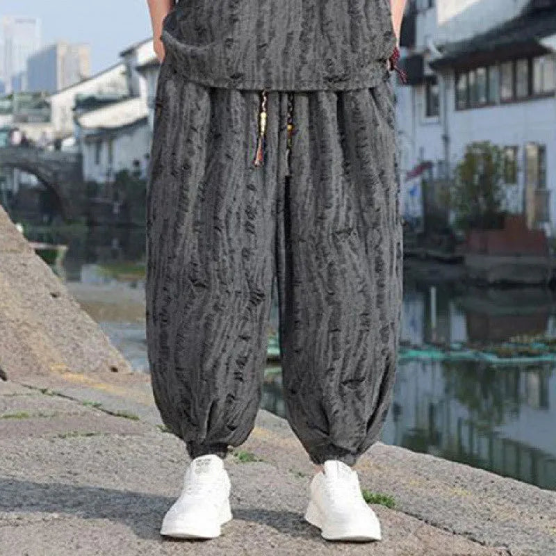 Men's black and grey knitted short-sleeve top with matching loose cropped trousers casual suit set