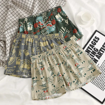 Men's grey printed cotton boxer shorts with mid waist and loose casual fit laid flat.