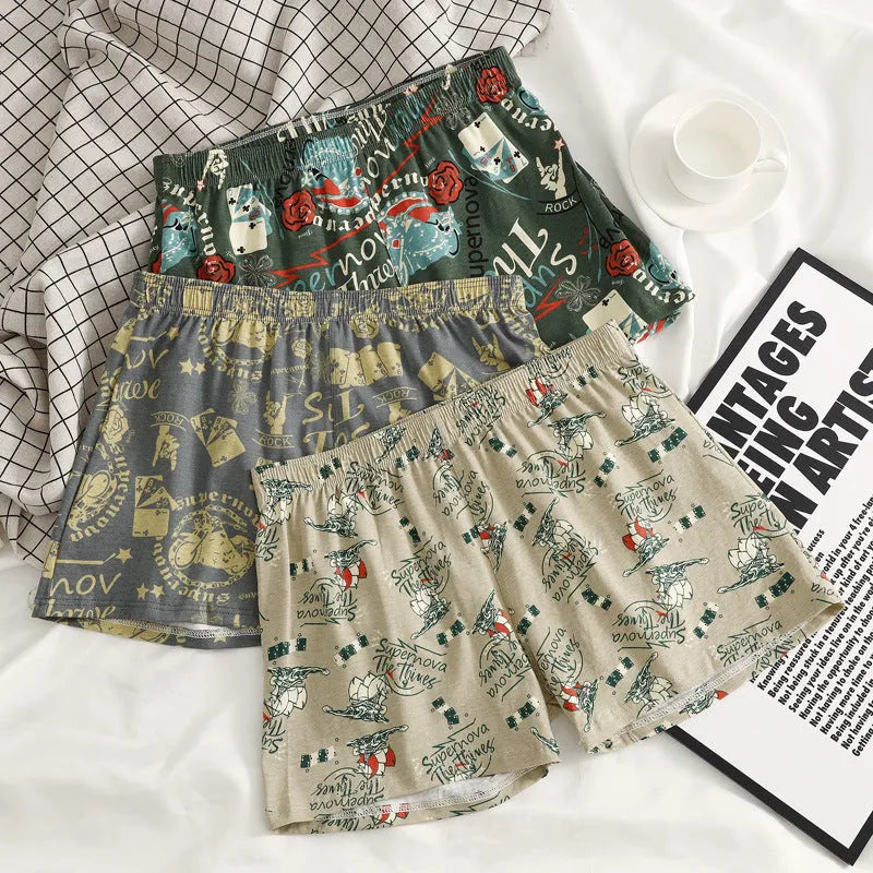 Men's printed cotton boxer shorts with mid waist and loose casual fit, available in grey, blue, and green colour options for comfortable and breathable home wear across multiple UK sizing ranges from M to XXXL