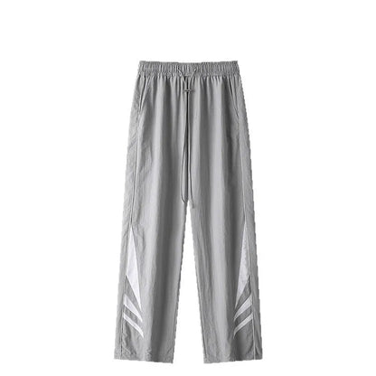 Men's black straight-leg trousers with non-iron fabric, elastic waistband, and plus sizes for summer wear