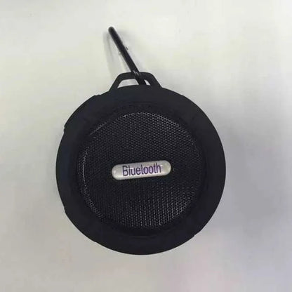 C6 portable waterproof Bluetooth speaker in multiple colours with a mounting clip attached.