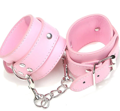 Black PU leather BDSM handcuffs showing adjustable buckle and 20cm connecting chain