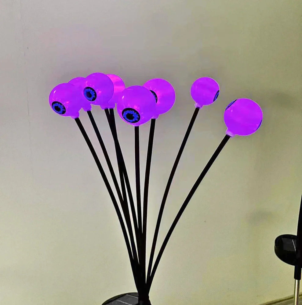 Solar-powered Halloween string lights with detailed eyeball design for outdoor garden decoration