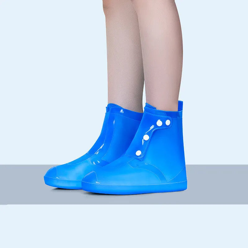 White high top PVC waterproof shoe cover for women with anti-skid sole.