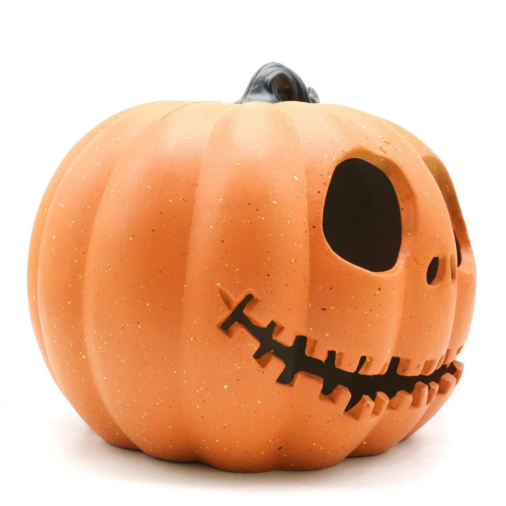 Halloween pumpkin lantern with hollow-out skull design measuring 23 by 19 centimetres