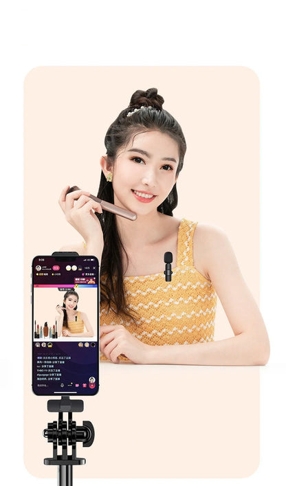 Wireless lavalier microphone with clip showing compact 130x90x25mm dimensions and multiple interface connectors