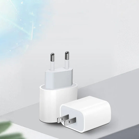 Mobile phone charger with USB interface showing American and European plug configurations