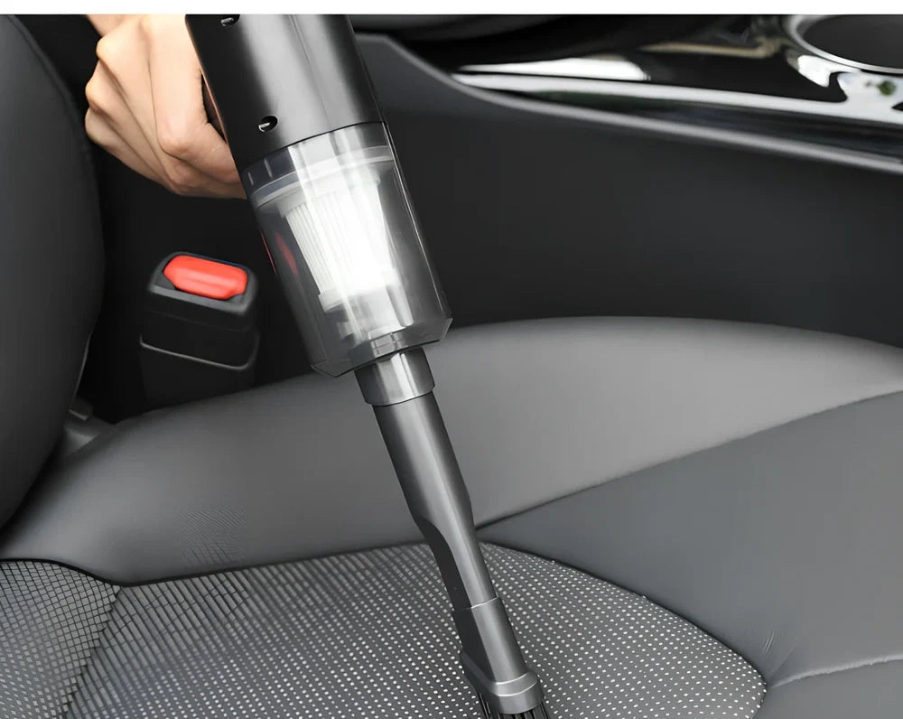 Black cordless car vacuum with suction head and brush attachment, 16.5cm size