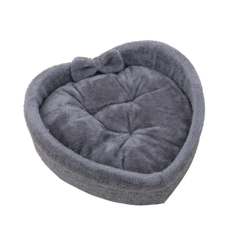 Cozy heart-shaped pet bed in grey and pink colors, suitable for cats and small dogs