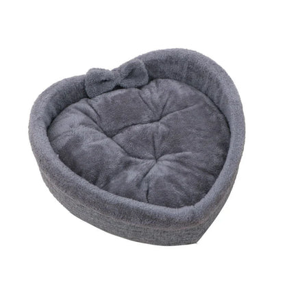 Cozy heart-shaped pet bed in grey and pink colors, suitable for cats and small dogs