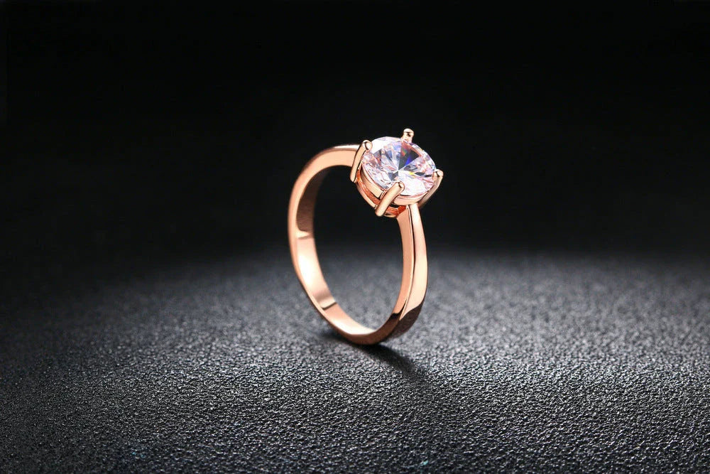Exquisite rose gold and zircon cocktail ring with intricate geometric design and sparkling zircon gemstones