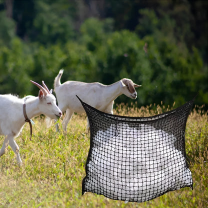Black woven grid hanging feeding bag for horses, shown against a stable background.