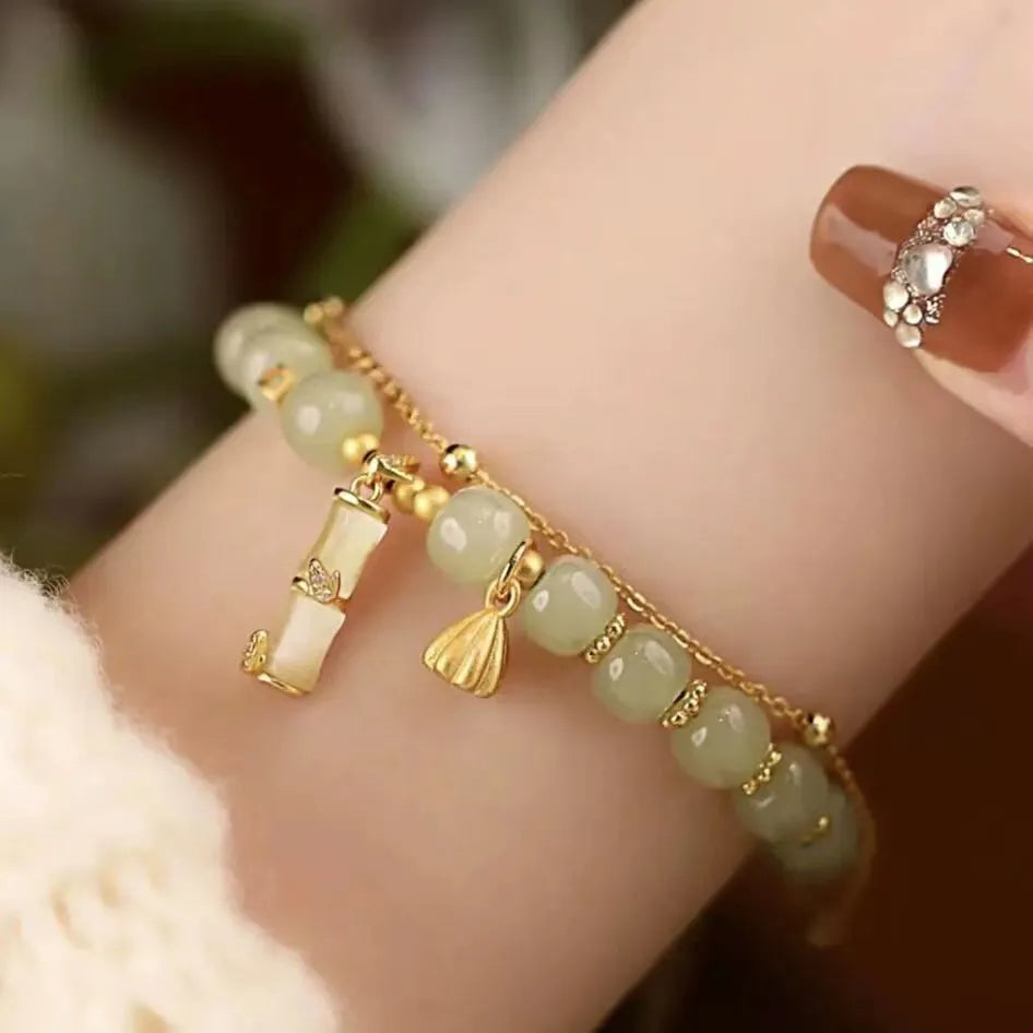 Retro bracelet with Ruyi flower design in glass and coloured glaze beads with electroplated accents