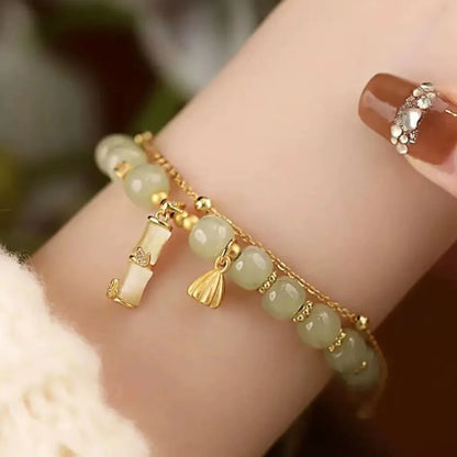 Retro bracelet with Ruyi flower design in glass and coloured glaze beads with electroplated accents