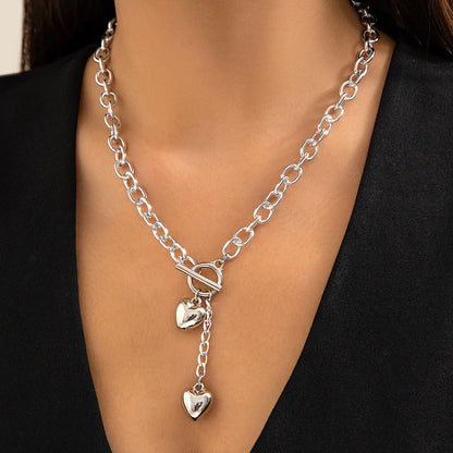 Stylish lock and key pendant necklace with a delicate chain, available in a variety of colors and materials