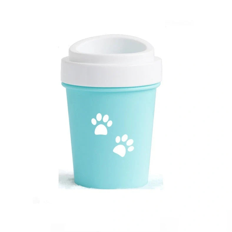 Silicone dog paw cleaner cup in blue, green, or pink with soft bristles for washing muddy paws