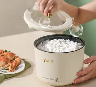 Compact round rice cooker with steam pan, non-stick inner pot, and mechanical dial, sized 160mm x 160mm x 190mm.