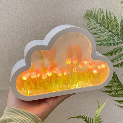 DIY tulip-shaped night lamp kit with LED lights and mirror surface in assorted colours on a desk.
