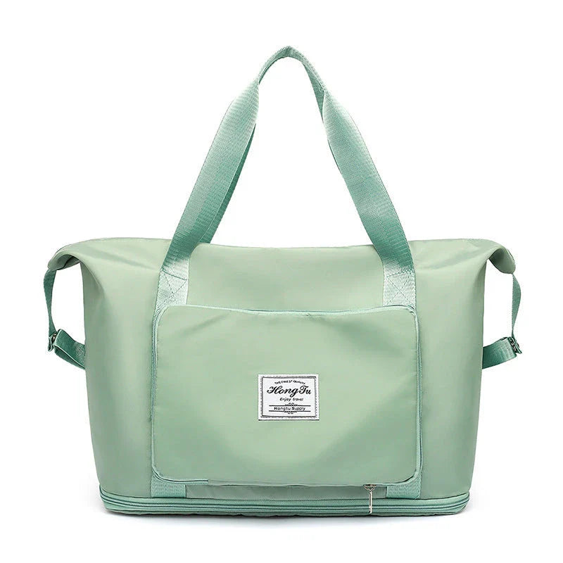 Roomy and foldable gym bag for women with waterproof Oxford fabric, multiple pockets, and wet/dry separation compartment