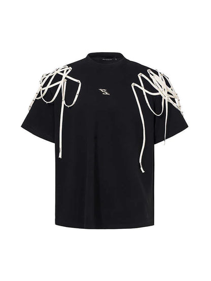Black loose fit short sleeve t-shirt with padded shoulder detail on a hanger.