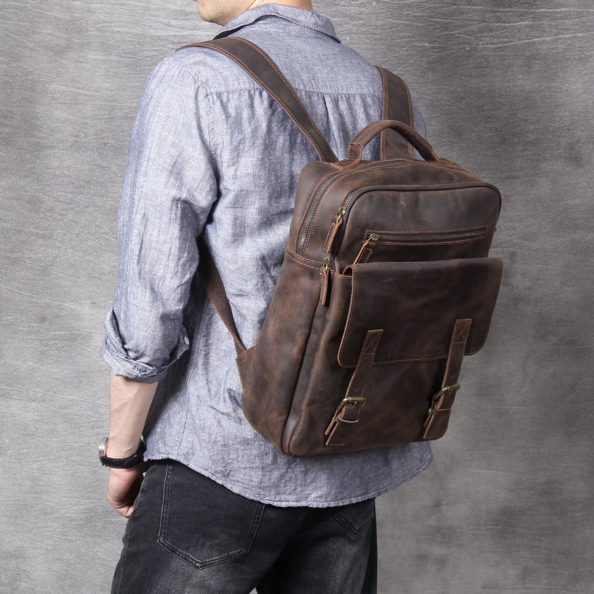 Dark coffee coloured retro leather backpack made from first layer cowhide with organised interior pockets.