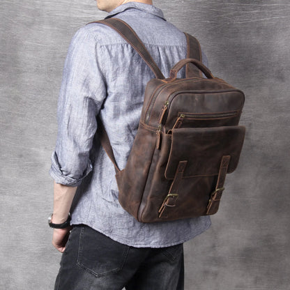 Dark coffee coloured retro leather backpack made from first layer cowhide with organised interior pockets.