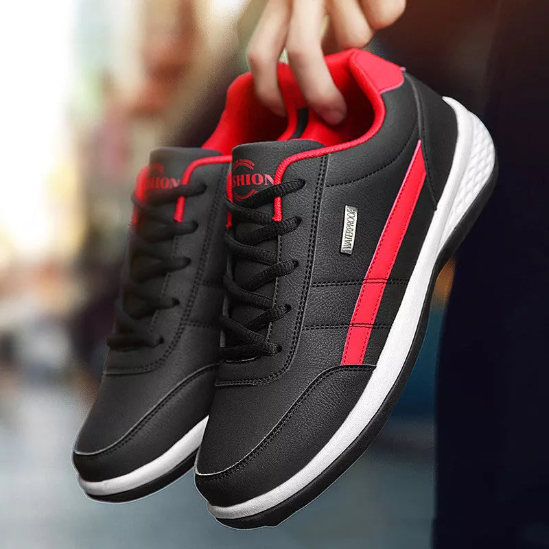 Round toe non-slip sports sneakers in black, blue, and white with breathable mesh design