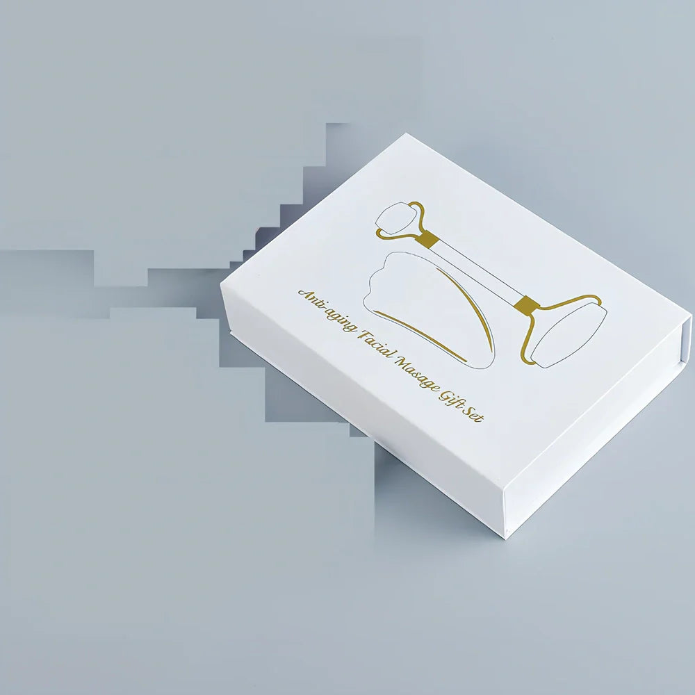 White jade facial roller with dual heads and matching scraping board for traditional Chinese massage therapy