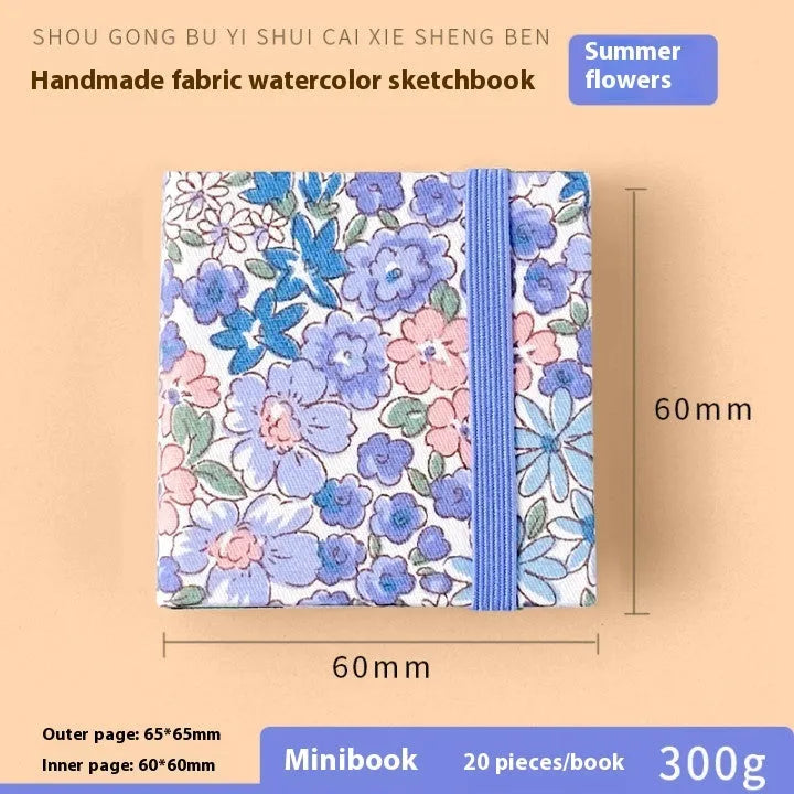 Feiluniao watercolour notebook with fabric cover, 185mm length, open to show paper for painting.
