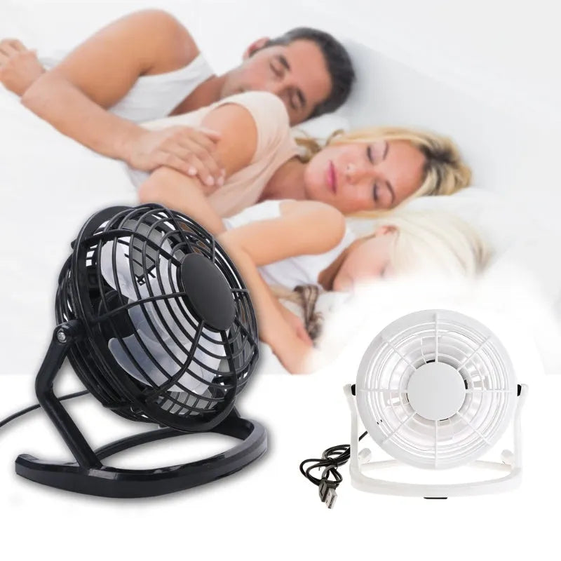 Black mini USB fan with adjustable angle mechanism and 96mm blades on desk