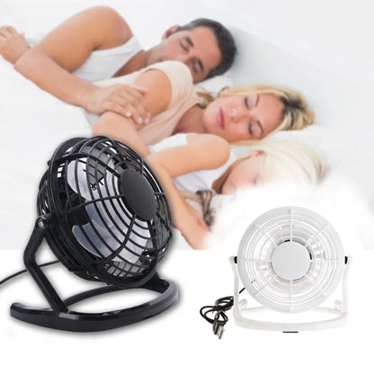 Black mini USB fan with adjustable angle mechanism and 96mm blades on desk