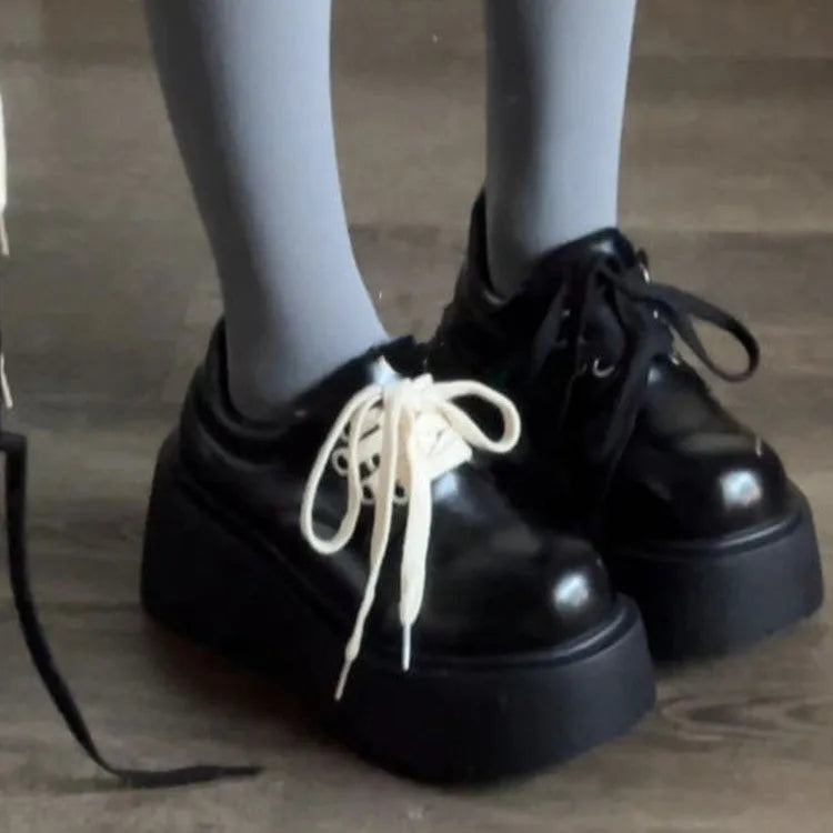 Women's black matte lace-up shoes with 6-8cm English muffin heel and round toe, shown on a neutral background