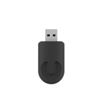 Small black rectangular CarPlay USB wireless adapter dongle on a white background.