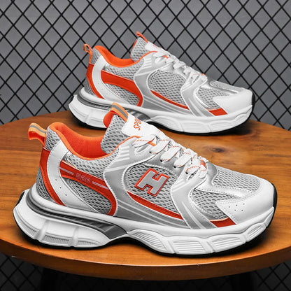 Men's white and grey mesh running shoes with round toe and plastic sole.