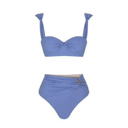 Women's green one-piece swimsuit with round buckle decoration and hollow-out stitching detail on nylon fabric.