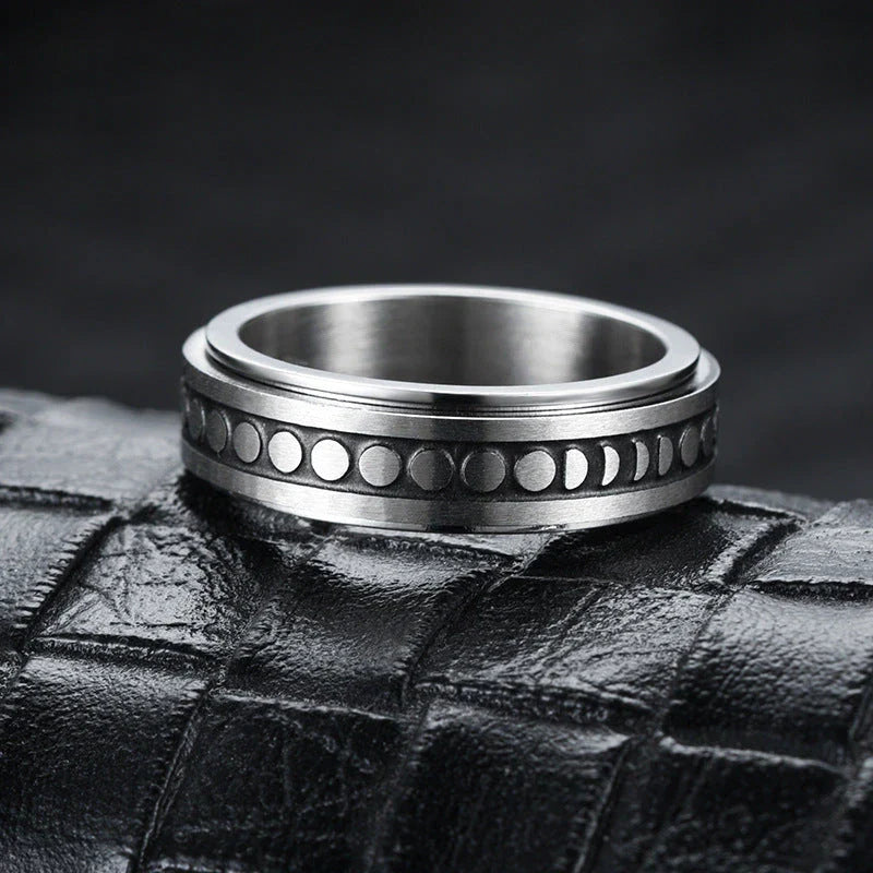 Stainless steel spinner ring with intricate moon and stars design