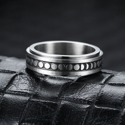 Stainless steel spinner ring with intricate moon and stars design
