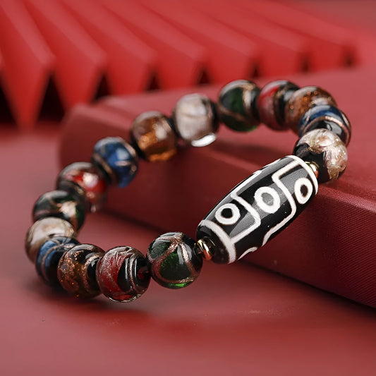 Colourful Chinese-style coloured glaze bracelet with auspicious patterns and snake symbol on beads.