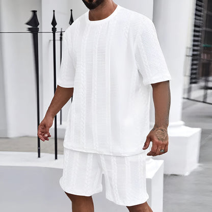 Knitted short-sleeve pullover and matching shorts set in light grey, laid flat.