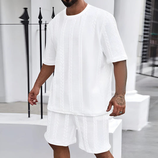 Knitted short-sleeve pullover and matching shorts set in light grey, laid flat.