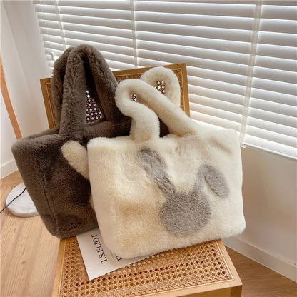 Cute cartoon rabbit ears design on a soft plush large capacity shoulder tote bag.
